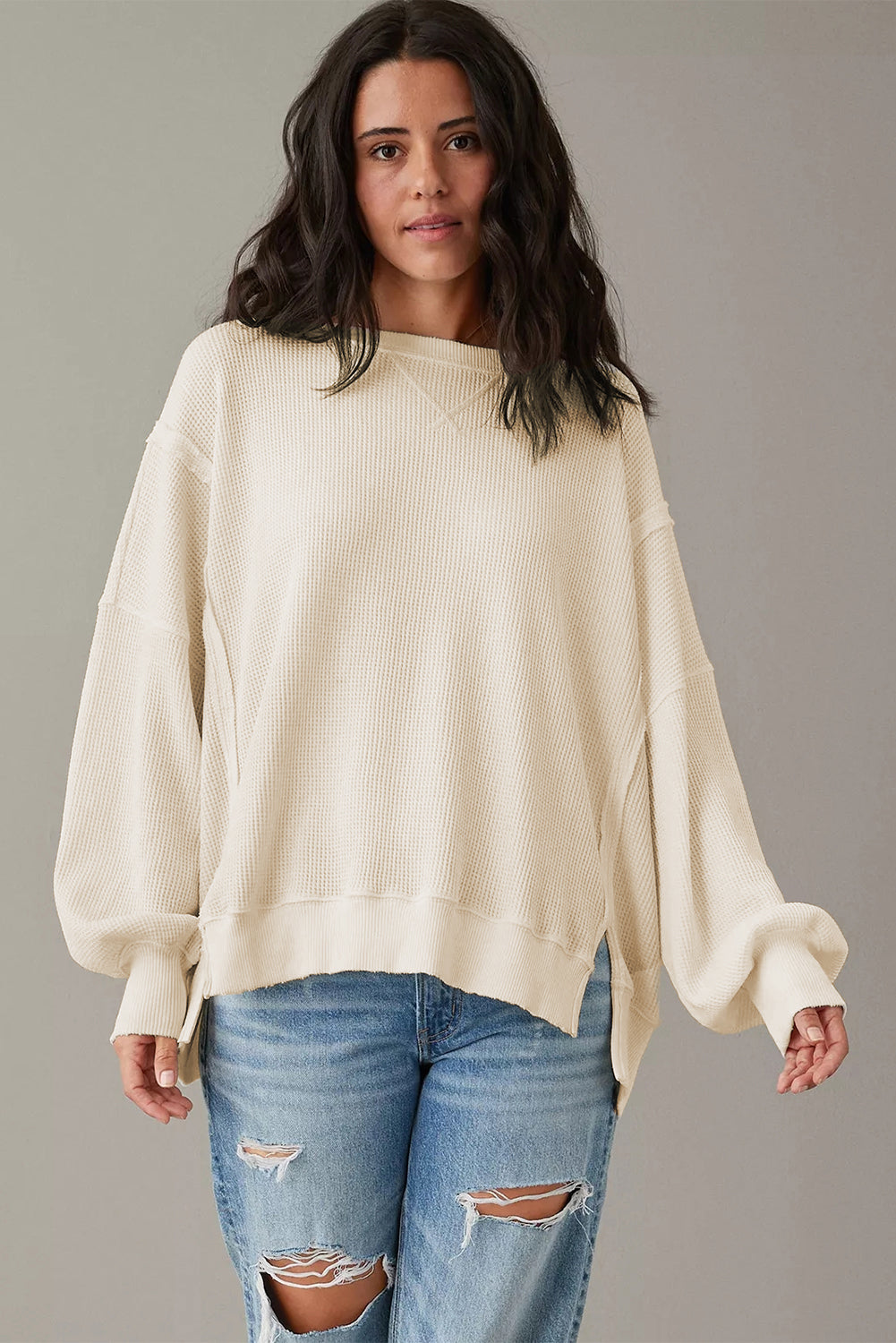 Top oversize con abertura y mangas obispo de punto gofre blanco