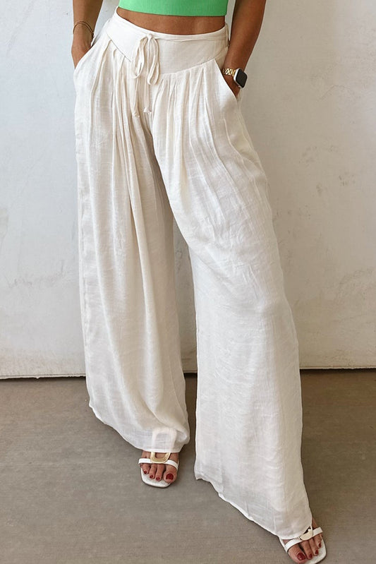 Pantalones anchos plisados ​​con cintura anudada y estilo casual blanco