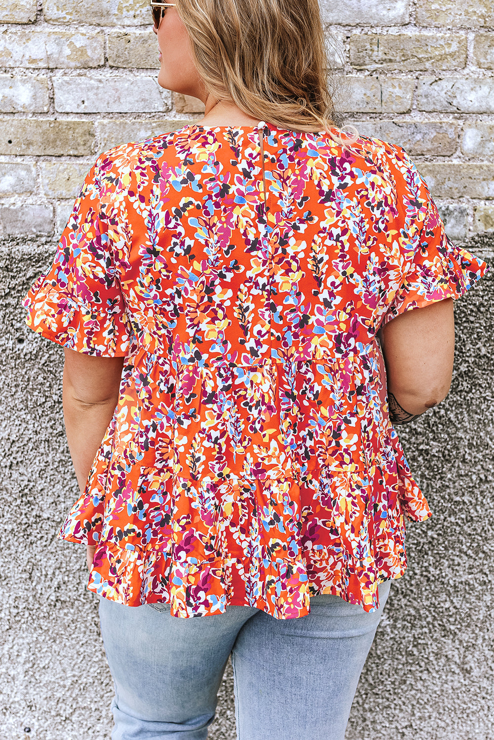 Blusa babydoll con volados y mangas con estampado floral en color naranja