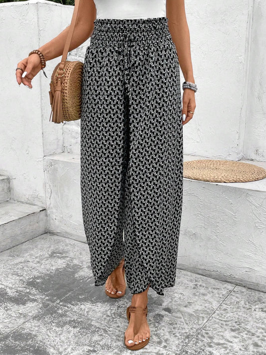 Pantalones de talle alto con abertura y pierna ancha con estampado bohemio negro