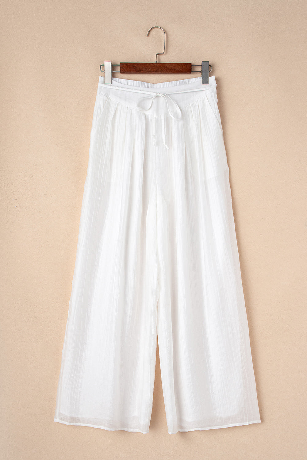 Pantalones anchos plisados ​​con cintura anudada y estilo casual blanco