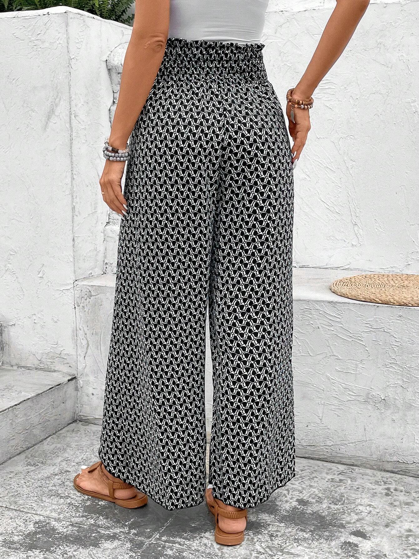 Pantalones de talle alto con abertura y pierna ancha con estampado bohemio negro