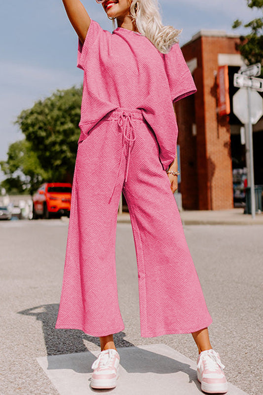 Conjunto de camiseta holgada con textura y pantalones con cordón en color rosa fresa