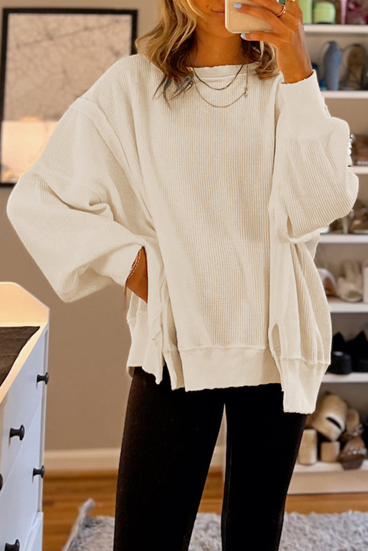 Top oversize con abertura y mangas obispo de punto gofre blanco