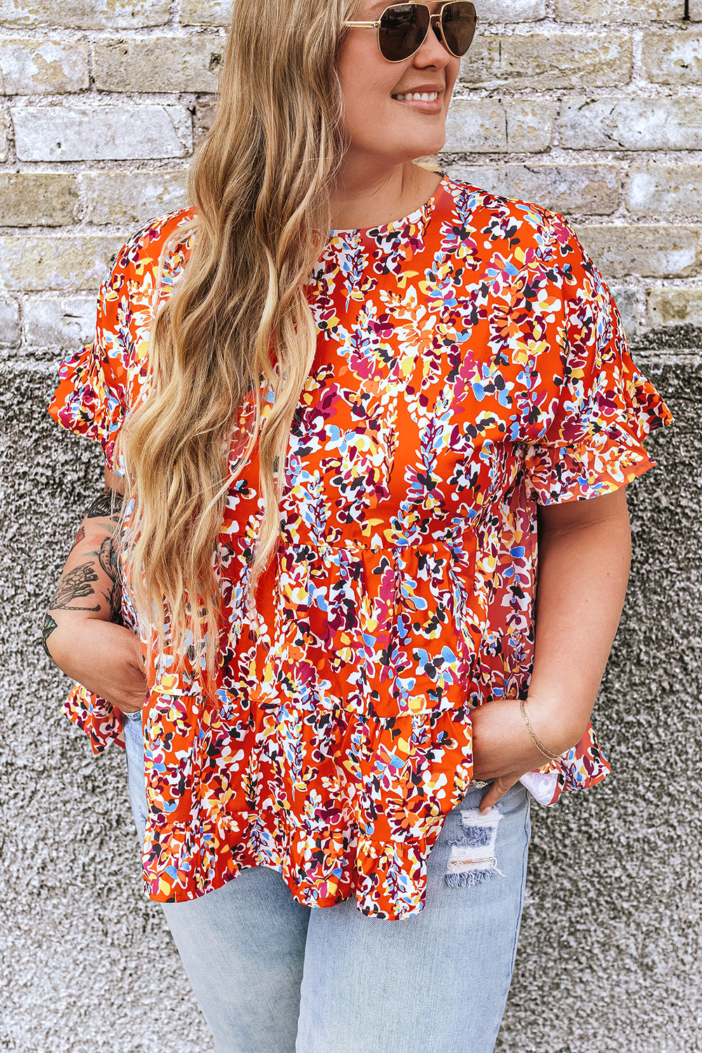 Blusa babydoll con volados y mangas con estampado floral en color naranja