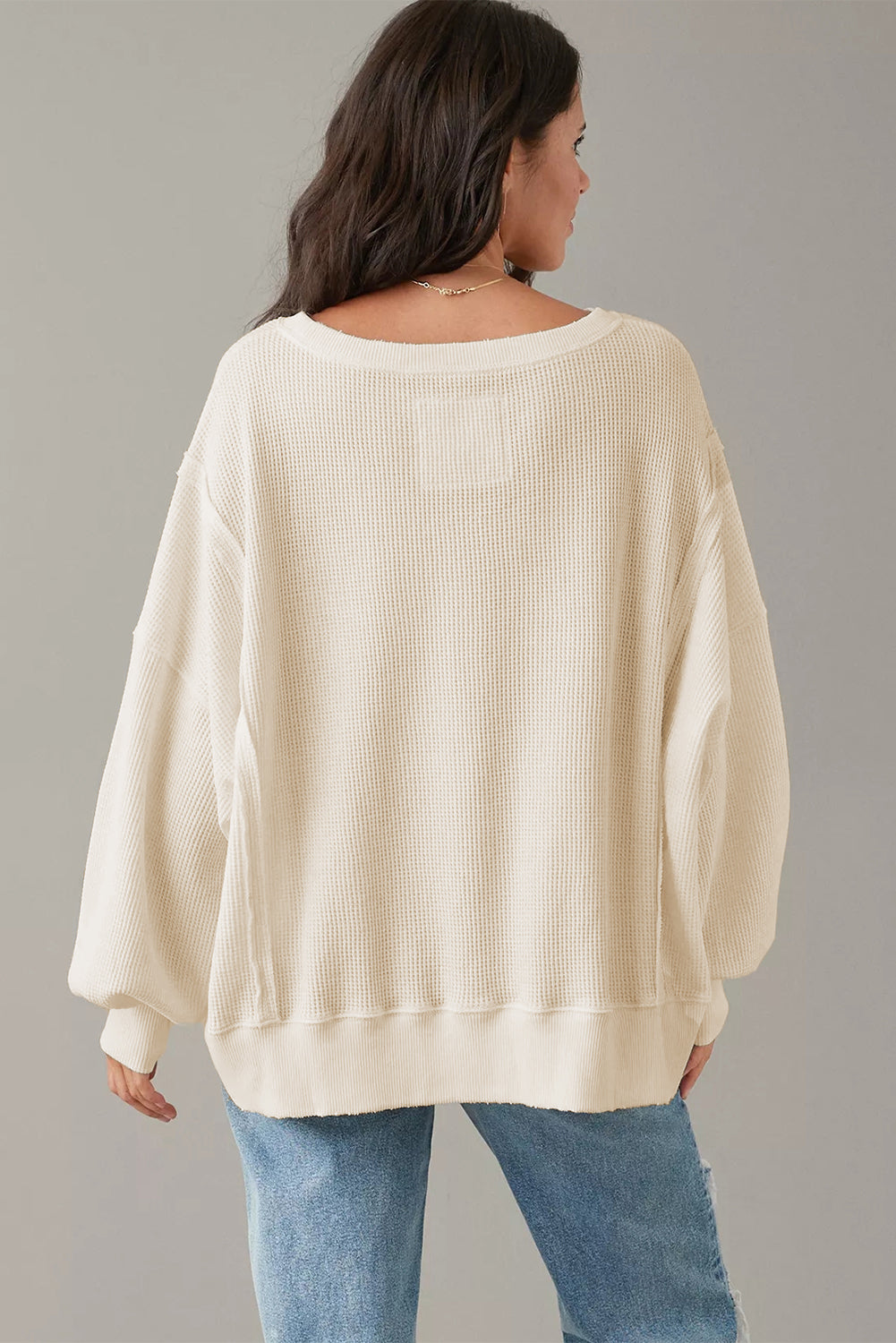 Top oversize con abertura y mangas obispo de punto gofre blanco