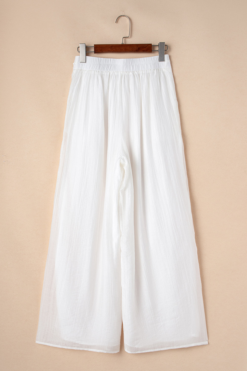 Pantalones anchos plisados ​​con cintura anudada y estilo casual blanco