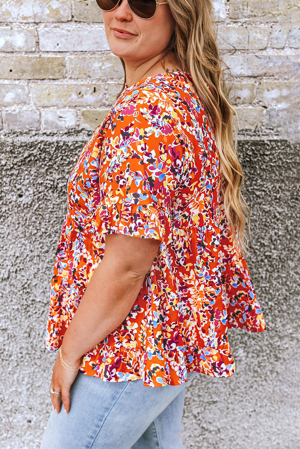 Blusa babydoll con volados y mangas con estampado floral en color naranja