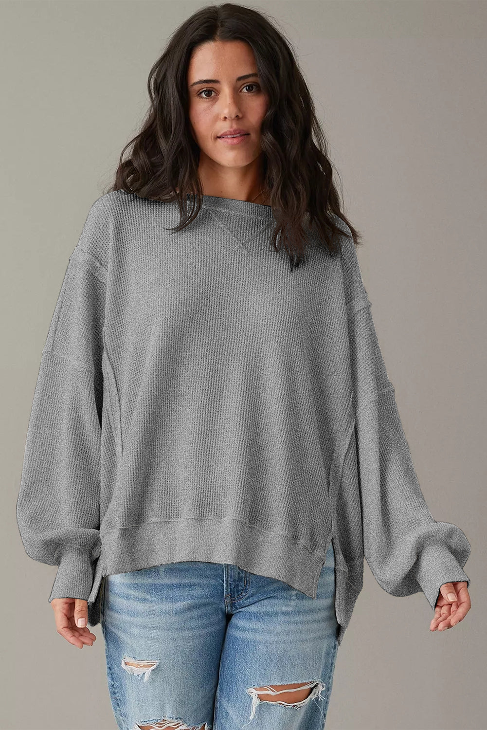 Top oversize con abertura y mangas obispo de punto gofre blanco